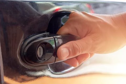 Hand on handle Close up of man hand opening car door Stock Photos