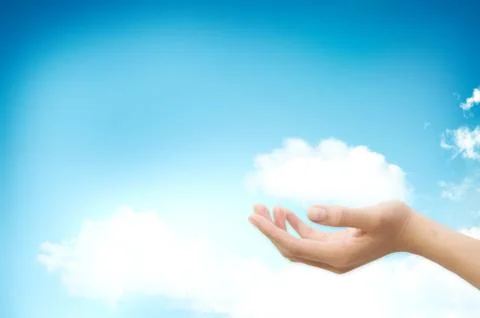 Hand handle cloud against blue sky with clouds on background. for cloud compu 写真素材