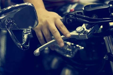 Hand on handlebars of motorcycle Fotos Stock