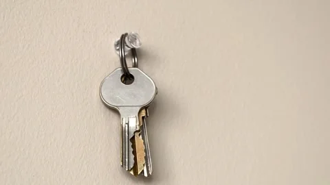 Hand Hanging Keys Back On Hook Stock Footage 329804690