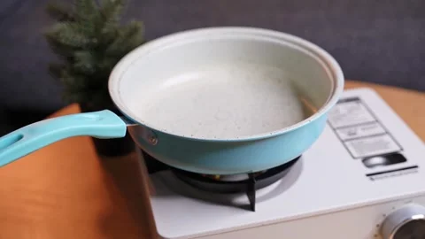 Hand Heating Pan On Gas Stove Stock Footage 340300331