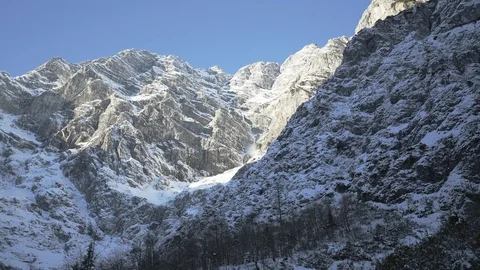 Hand held of Avalanche in Snowy Alps in winter sun Stock Footage 120979737