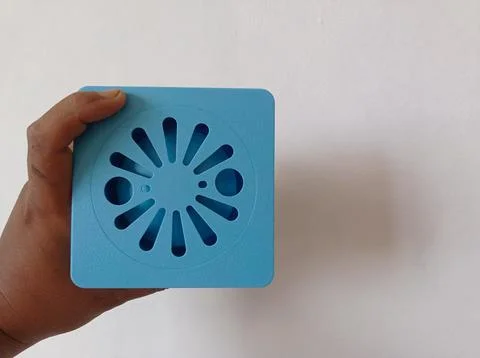 Hand held blue plastic sewer filter. floor drain Stock Photos