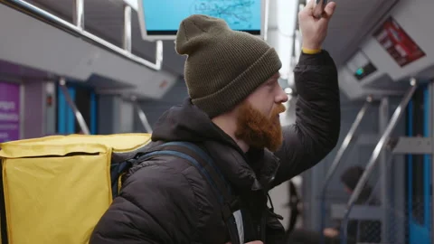Hand-held camera. The courier is standing in a subway car Stock Footage 236089577