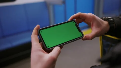 Hand-held camera. Delivery of orders. Male courier watch movies in a subway car Stock Footage 236089781