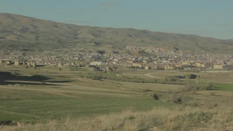 Hand held camera panning of Uçhisar in Cappadocia Stock Footage 113300723