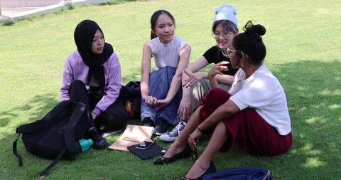 Hand held camera shake Four young attractive Asian group woman friends collea Stock Footage 198862448