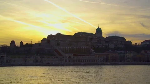Hand-held camera shot of Royal Palace at sunset Stock Footage 79760539