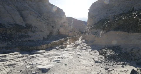 Hand held camera walking in a deep gullie, canyon, dry river 스톡 동영상 96476401