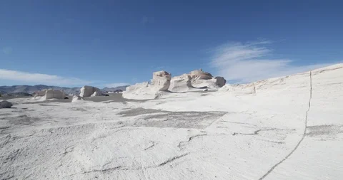 Hand held camera walking over white pumice rocks between natural scultures 스톡 동영상 103484562