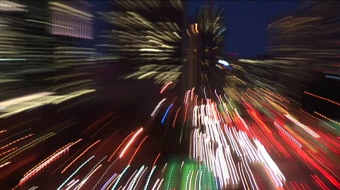 A hand-held camera zooms in and out of Seattle at night Stock Footage 437843