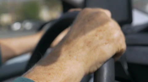 Hand held close up of hands driving while operating a GPS in a car Video stock 61493664