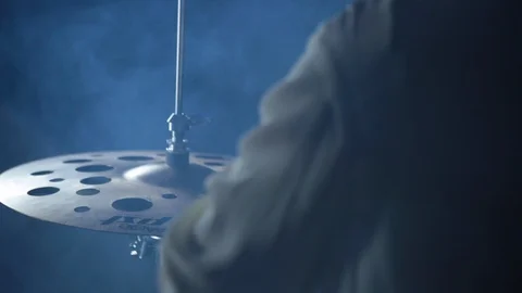 Hand held close up of hi hat &amp; xylophone as musician plays in smoke filled room Stock Footage 98757359