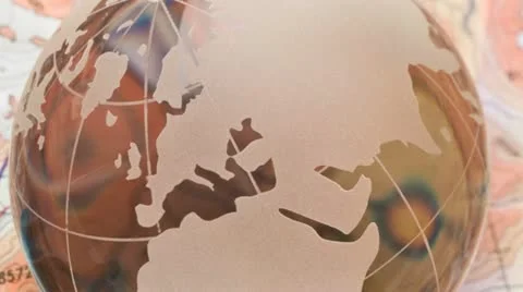 Hand held compass and crystal globe against a map Stock Footage 21315014