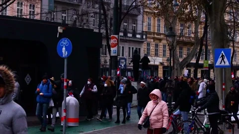 A hand held pan over protesters marching against corona laws in Vienna, Aust Stock Footage 146735537