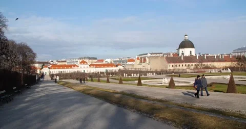 Hand held pan of people walking at the Belvedere park in Vienna, Austria on  Stock Footage 147277724