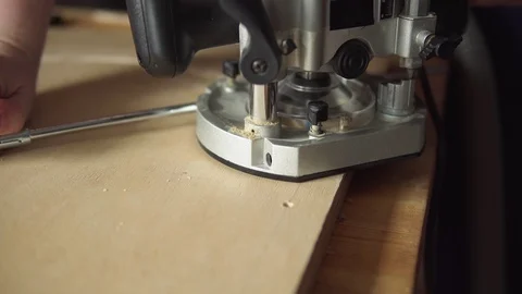 Hand-held plunge router cut round detail out of plywood. Stock Footage 108319764