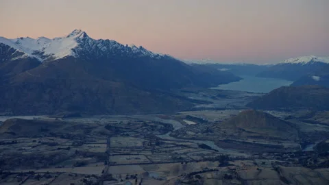 Hand held POV of epic snow capped mountain range in pre dawn glowing sky Stock Footage 159696332
