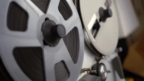 Hand held pullback of a reel to reel tape deck Stock Footage 144378710