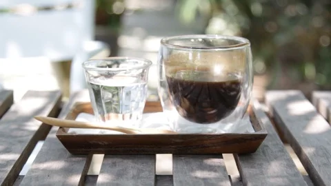 Hand held shot: Black coffee Stock Footage 105552443