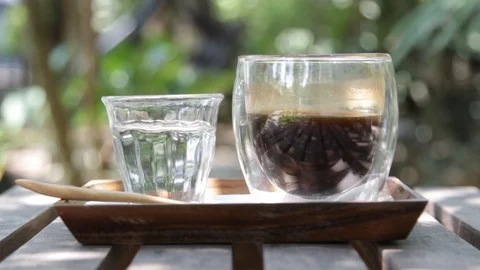 Hand held shot: Black coffee Stock-Footage 105552489