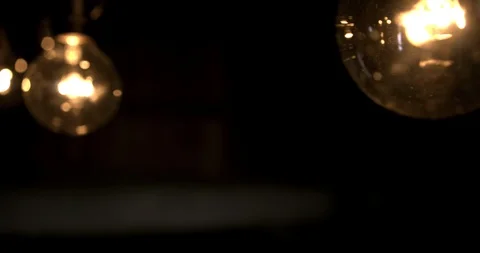 Hand held shot of a group of light bulbs Stock Footage 98357189