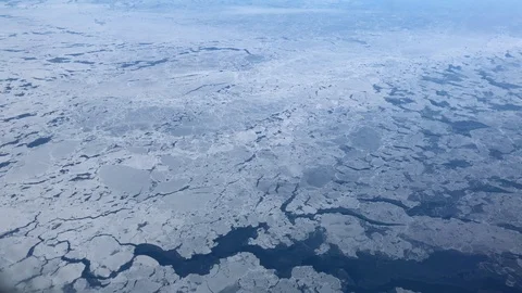 Hand-held shot of huge chunks of ice frozen over the Bering Sea Stockbeeldmateriaal 90234697