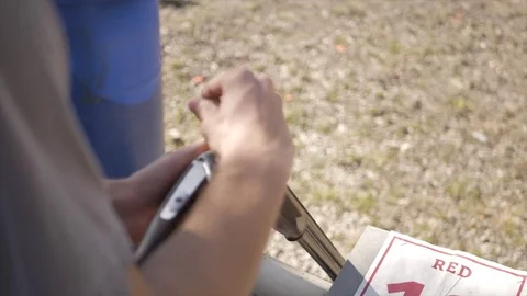Hand Held Shot of Loading Over Under Shotgun Video stock 76011238
