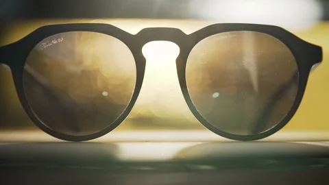 Hand held shot of stylish glasses in sunset Stock Footage 102728898