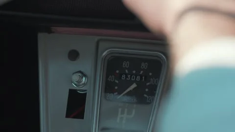Hand-held shot of a vintage Deux Chevaux cars odometer with someone driving Video stock 246729577