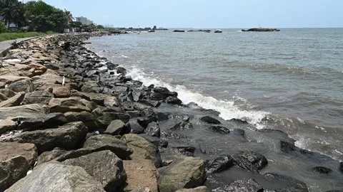 A hand held, slow motion view of the coastline with ocean tides reaching Video stock 319866084