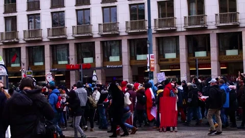 A hand held static shot of anti corona law protesters in Vienna, Austria Stock Footage 146737391