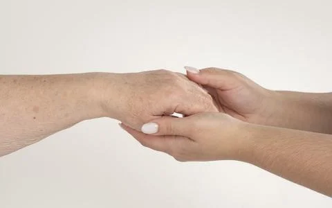 Hand help supports elderly. Hand help guides young. Hand help shares compassi Stock Photos