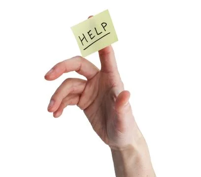 Hand With Help On Yellow Note Stock Photos