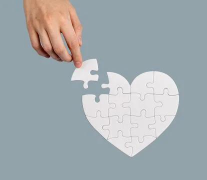 Hand helping with lacking puzzle piece, solving problem, finding solution Foto stock