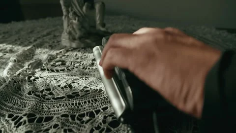 Hand hesitates before making call on corded push button telephone Stock Footage 309788267
