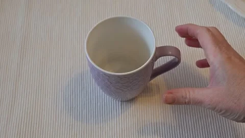 Hand Hesitating Near Empty Mug, Decision Moment Concept Stock Footage 336898067