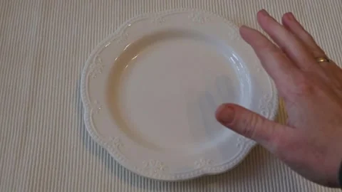 Hand Hesitating Near Empty White Plate, Decision Moment Concept Stock Footage 337014553