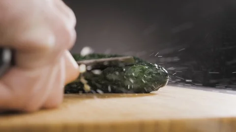 Hand hits a cucumber with a large knife Stock Footage 117520523