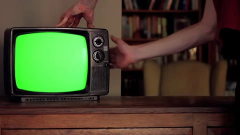 Hand Hitting Retro TV with Static Before Green Screen Appears, Vintage TV 4K Stock Footage 316102143