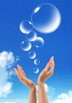 Hand hold Bubbles in the sky Fotos Stock