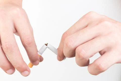 Hand hold cigarette destroy isolated on white background Stock Photos