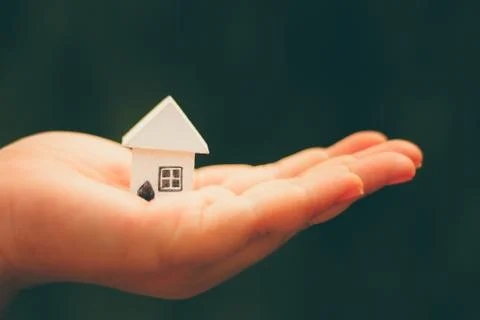 Hand hold home model Stock Photos
