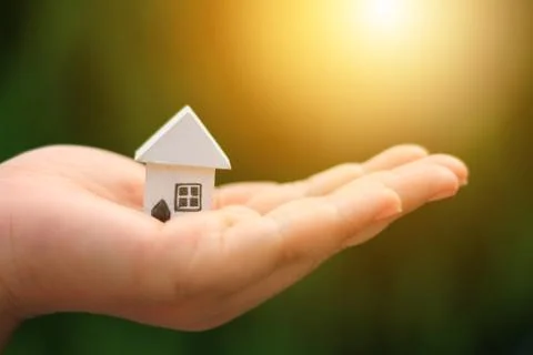 Hand hold home model Stock Photos