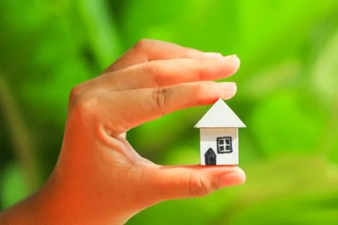 Hand hold home model Stock Photos