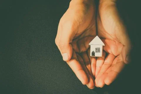 Hand hold home model Stock Photos