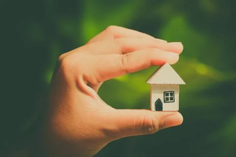 Hand hold home model Stock Photos