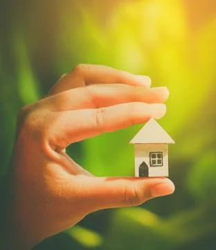 Hand hold home model Stock Photos