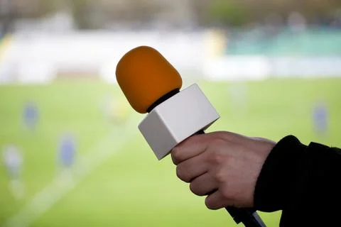 Hand hold microphone for  interview during a football mach Foto stock
