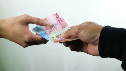 Hand hold money rupiah,transaction concept, financial concept Stock Photos